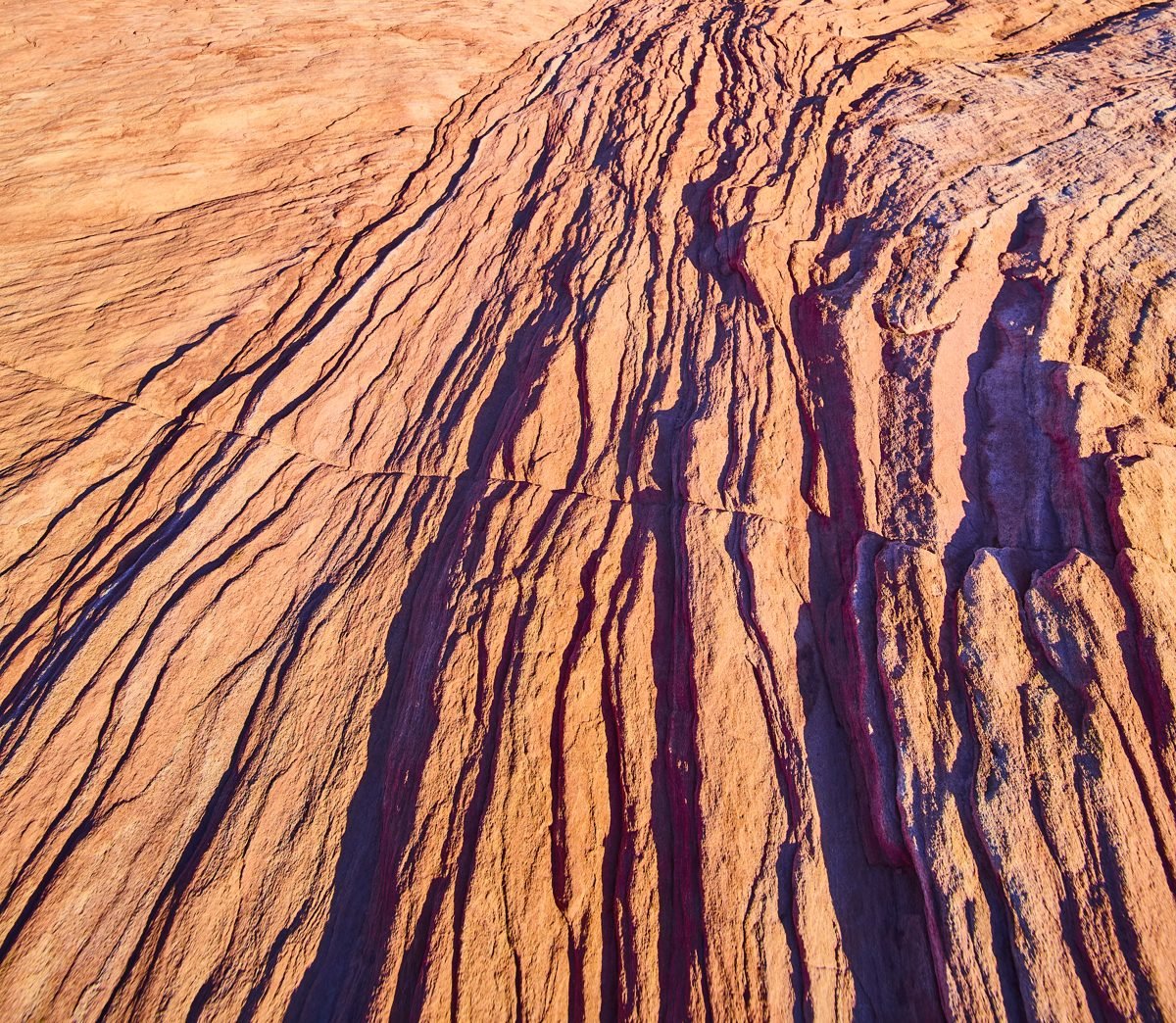 Close-up of layered red sandstone lines